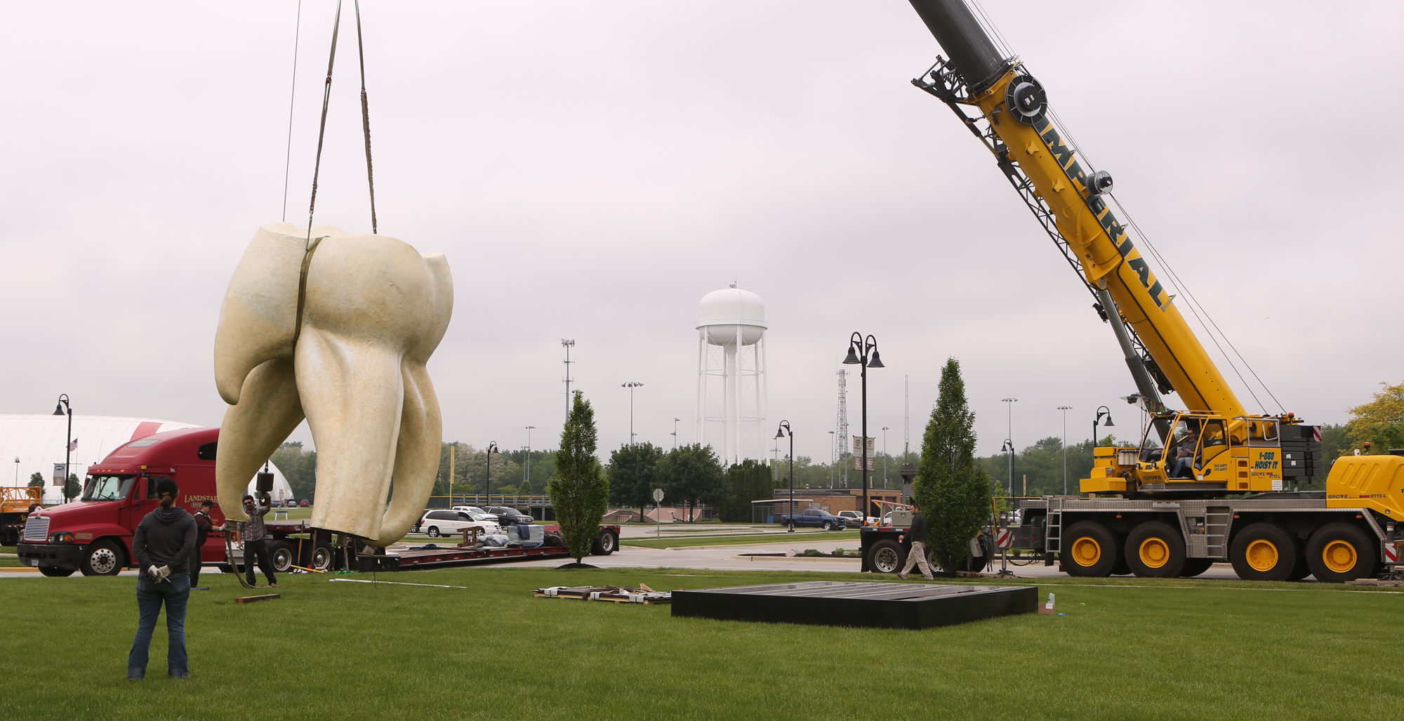 Artist Seward Johnson's "The Tooth" is implanted at the Crown Point Sportsplex
